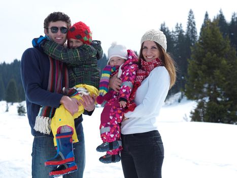 Winter playing, fun, snow and family portrait  sledding at winter time