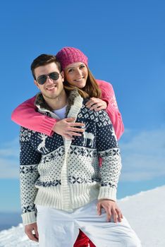 Young Couple In winter Snow Scene at  beautiful sunny day