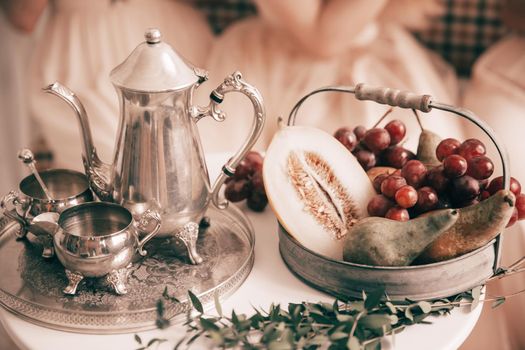 close up.coffee set and fruit bowl on the table at the newlyweds