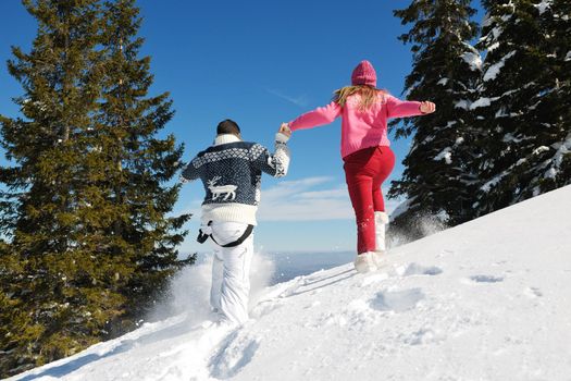 Young Couple In winter Snow Scene at  beautiful sunny day