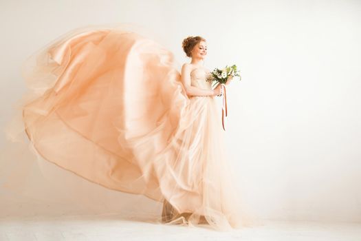 in full growth. the bride with a bouquet in a beautiful wedding dress . photo with copy space