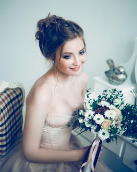beautiful young woman bride with wedding bouquet. holidays and events