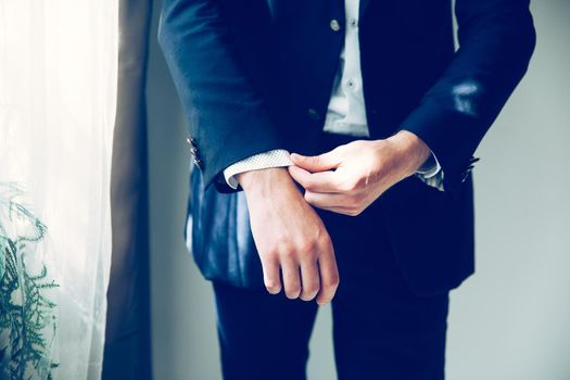 close up.business man adjusting his cuff links. people and events