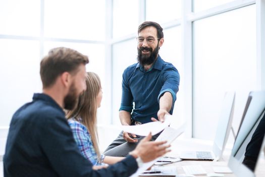 boss discussing with employees a new contract . office weekdays