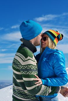 Young Couple In winter Snow Scene at  beautiful sunny day