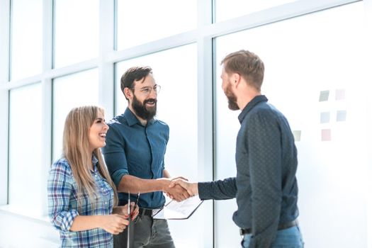 group of business people with documents standing in the office corridor. office weekdays