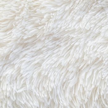 Long pile carpet texture. Abstract background of shaggy white fibers. High quality photo