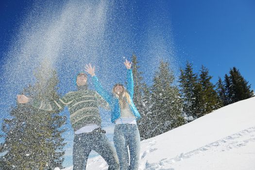 Young Couple In winter Snow Scene at  beautiful sunny day