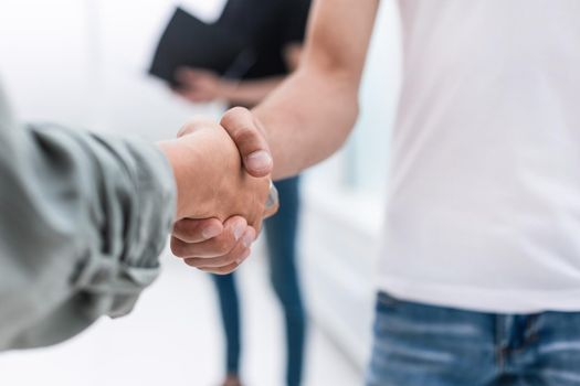 close up. business handshake over blurry background . photo with a copy of the space.