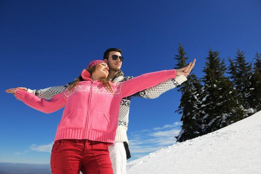 Young Couple In winter Snow Scene at  beautiful sunny day