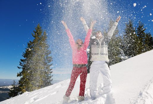 Young Couple In winter Snow Scene at  beautiful sunny day