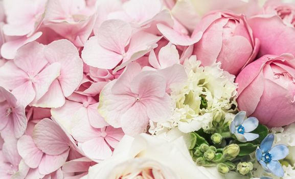 Beautiful flower bouquet arrangement close up in pastel colors. Decoration of roses and decorative plants, selective focus