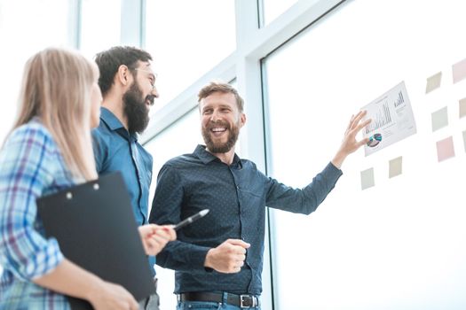 happy business team discussing the results of a new financial project . photo with copy space