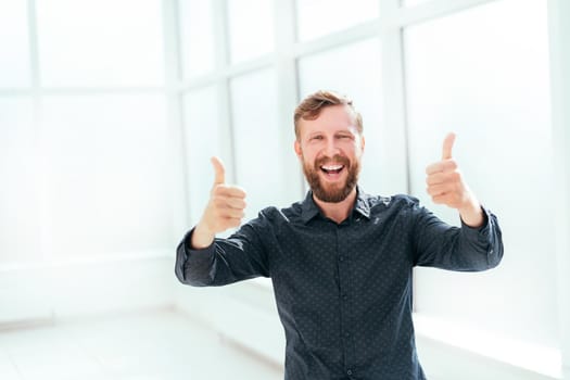 happy businessman showing thumbs up. photo with space for text