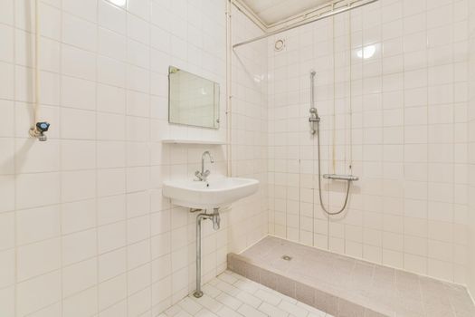 Miniature bathroom with white tiles in a luxurious house