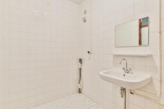 Miniature bathroom with white tiles in a luxurious house