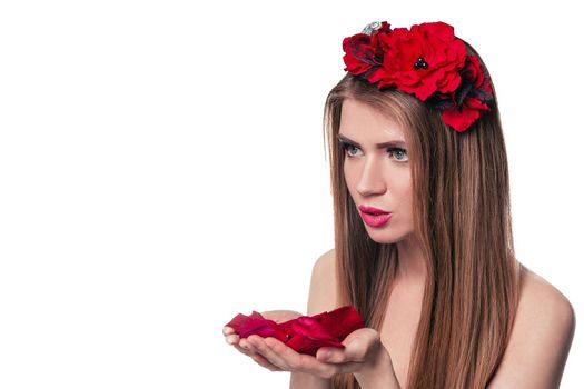 beautiful blonde woman looking rose petals in her hands. isolated on white background