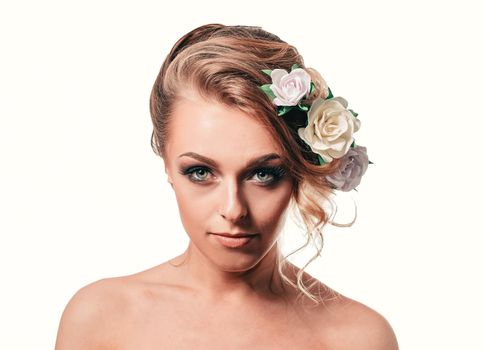 young woman with stylish hair and evening makeup . isolated on white background
