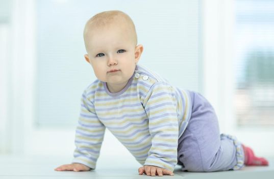 pretty little girl sitting on the floor in the living room.photo with copy space