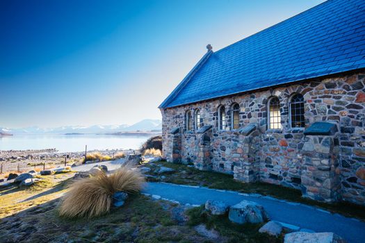 Majestic Lake Tekapo and the Church of the Good Shepherd at sunrise on a cool spring morning in New Zealand