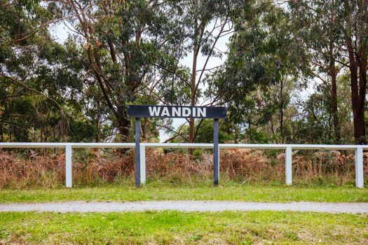 The popular Lilydale to Warburton Rail Trail and rural landscape at the disused Wandin station on a warm autumn day in Victoria, Australia