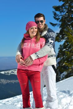 Young Couple In winter Snow Scene at  beautiful sunny day