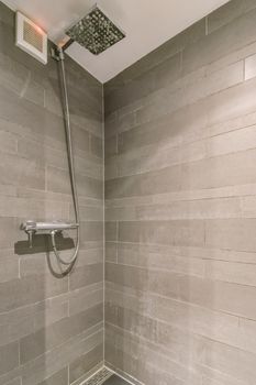 Modern shower stall in a bright bathroom