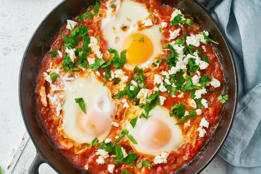 Shakshouka, eggs poached in sauce of tomatoes, olive oil, peppers, onion and garlic, Mediterranean cuisine. Keto meal, FODMAP recipe, low carb