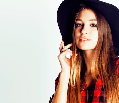 young pretty brunette girl hipster in hat on white background casual close up dreaming smiling, lifestyle people concept