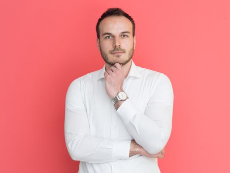 portrait of a handsome young man isolated over a red background