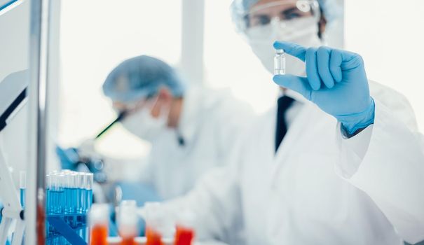 close up. background image of a scientist recording test results in a lab log. photo with a copy-space.