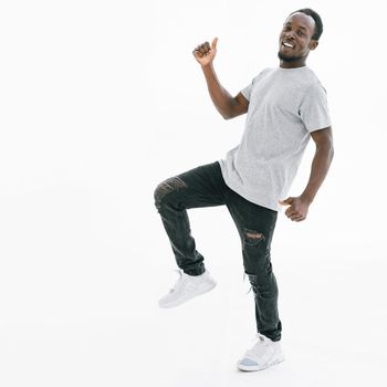 side view. happy guy showing thumbs up. isolated on white background