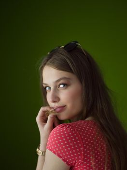 Portrait of beautiful young women isolated on a green background