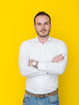 portrait of a handsome young man isolated over a yellow background