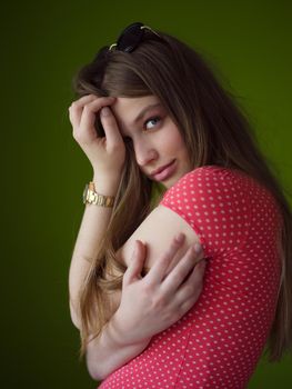 Portrait of beautiful young women isolated on a green background