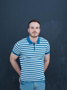 portrait of a handsome young man isolated over a gray background
