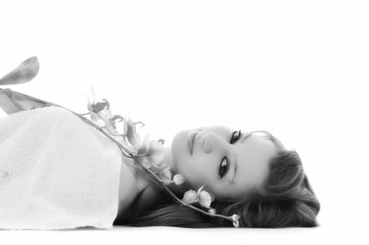 beauty halth and spa wellness isolated young woman face portrait closeup with towel and flower treatment