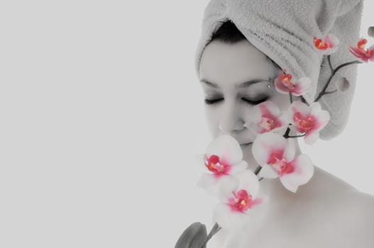 beauty halth and spa wellness isolated young woman face portrait closeup with towel and flower treatment