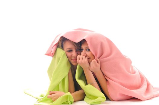 two youg happy giril woman smiling unger blanket isolated representing concept of lesbian love, happynes and softnes