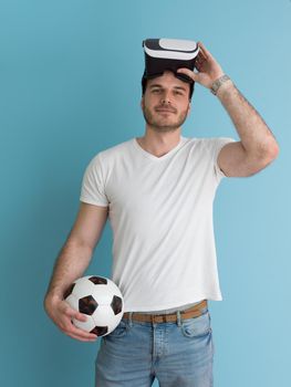 Happy man getting experience using VR headset glasses of virtual reality, isolated on blue background