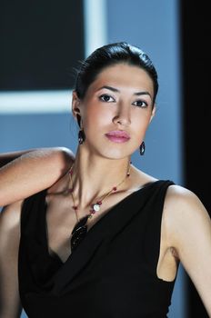 beautiful woman on fashion show piste with gold jawel