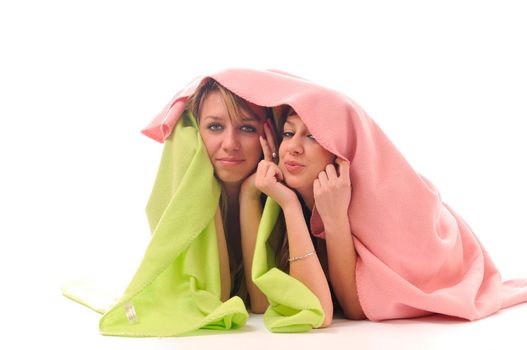 two youg happy giril woman smiling unger blanket isolated representing concept of lesbian love, happynes and softnes