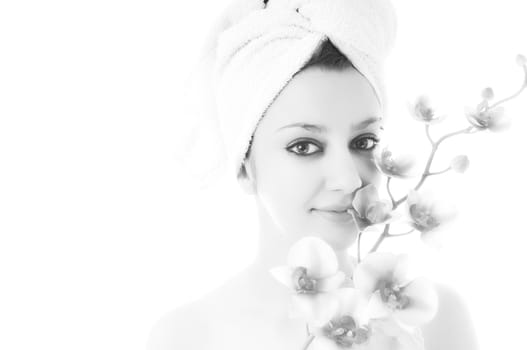 beauty halth and spa wellness isolated young woman face portrait closeup with towel and flower treatment