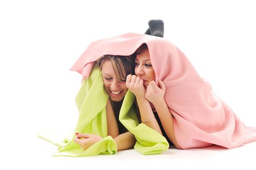two youg happy giril woman smiling unger blanket isolated representing concept of lesbian love, happynes and softnes