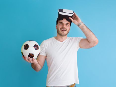 Happy man getting experience using VR headset glasses of virtual reality, isolated on blue background