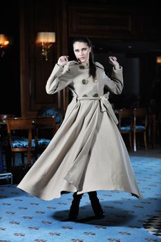 beautiful young woman lay in fashionalbe dress posing in restaurant