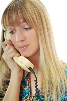 young woman talking by old phone isolated on white