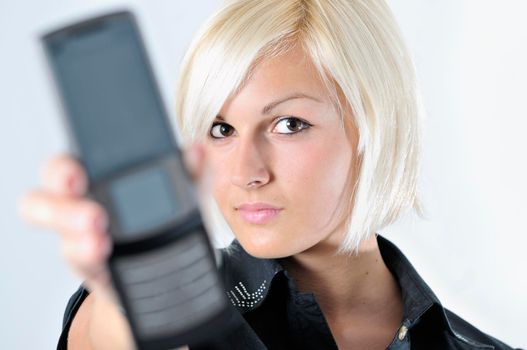 portrait of young blonde business woman holding new modern cellphone