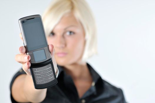 portrait of young blonde business woman holding new modern cellphone