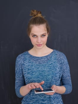 Happy young woman using tablet computer isolated over gray background